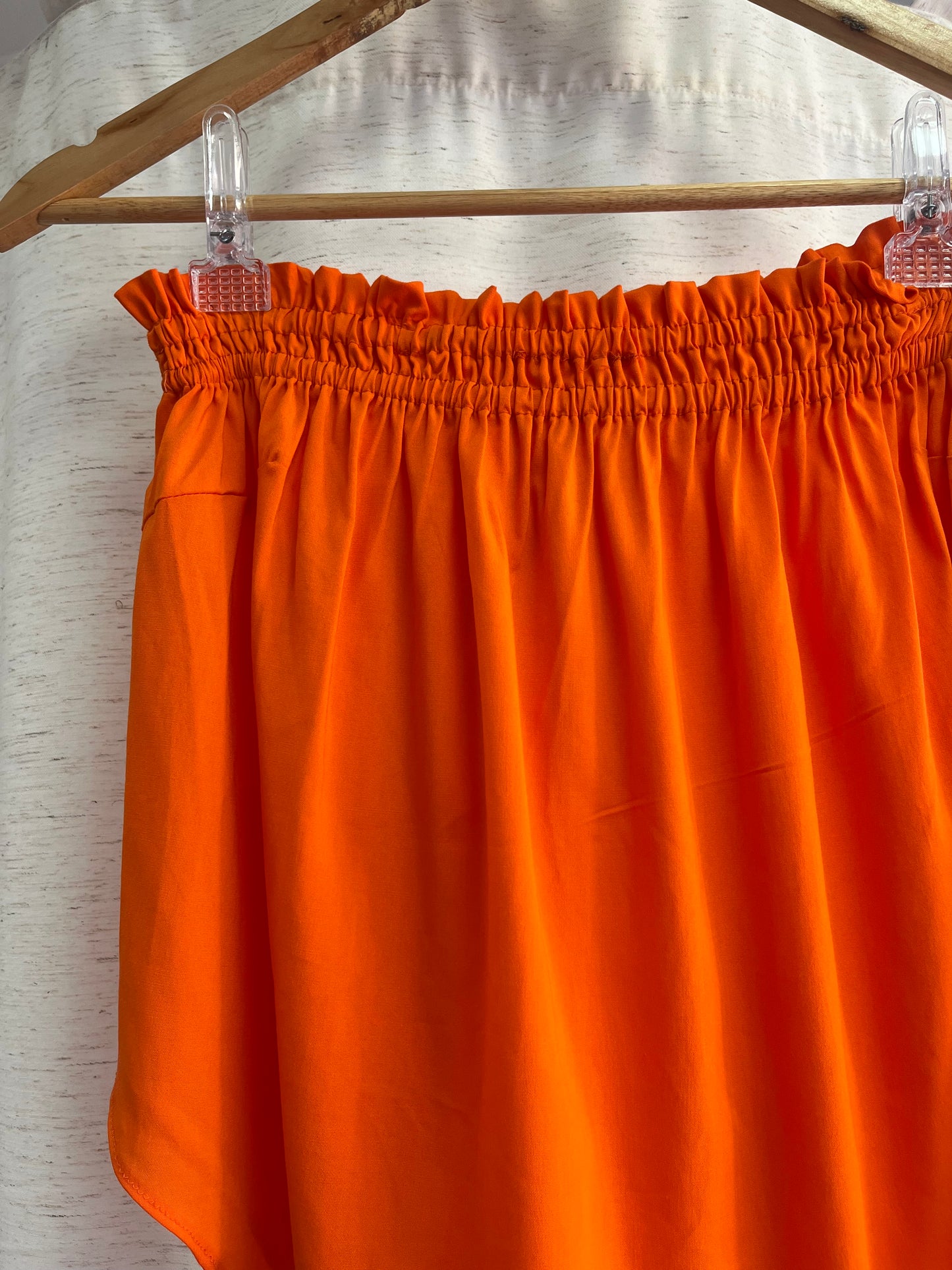Bata assimétrica laranja